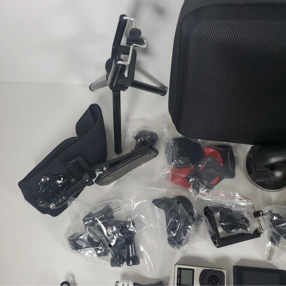 GoPro Hero4, Two Batteries, And Accessories Lot. Mounts, Body And Head Harness